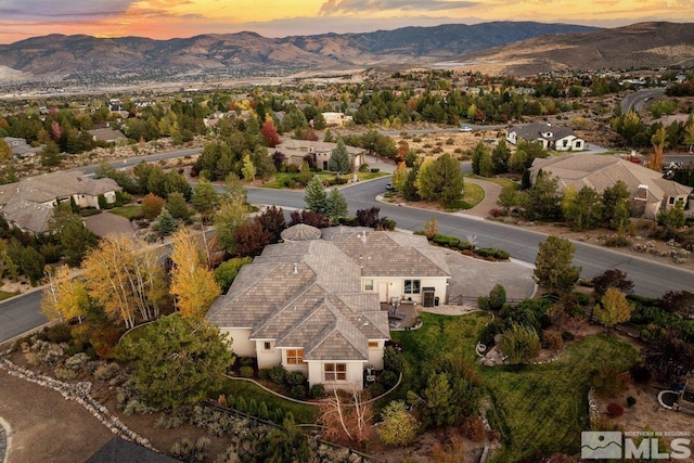 aerial view at dusk with a mountain view