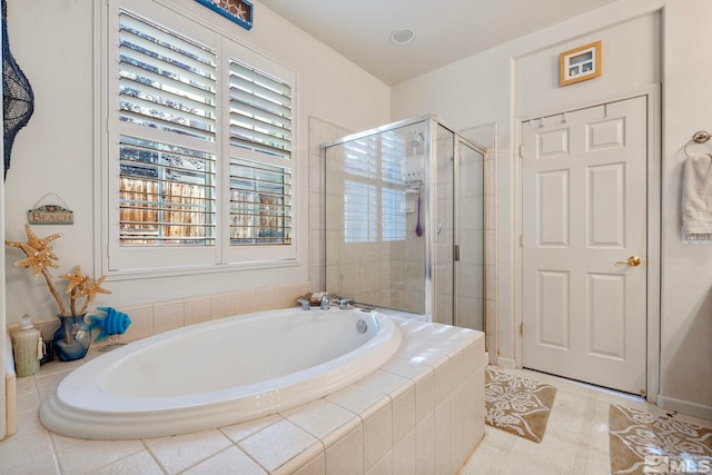 bathroom with shower with separate bathtub