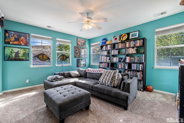 interior space featuring ceiling fan and carpet flooring