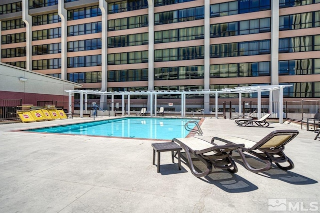 view of swimming pool featuring a patio area