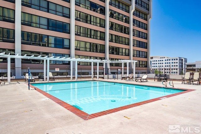 view of swimming pool with a patio area