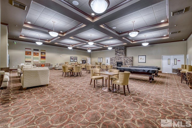 interior space with carpet flooring, pool table, a fireplace, coffered ceiling, and beamed ceiling