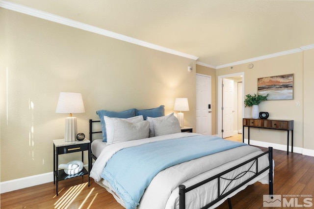 bedroom featuring crown molding and hardwood / wood-style floors