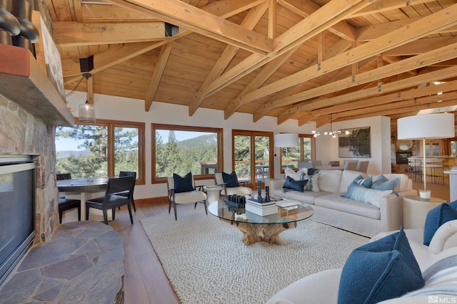 living room featuring high vaulted ceiling, wood ceiling, beamed ceiling, hardwood / wood-style flooring, and a chandelier