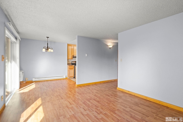 spare room with light hardwood / wood-style flooring, a notable chandelier, a textured ceiling, and a baseboard radiator