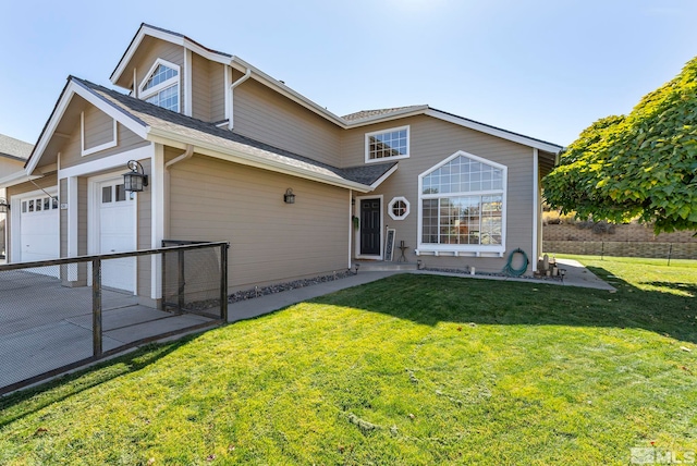 view of front property with a front yard and a garage