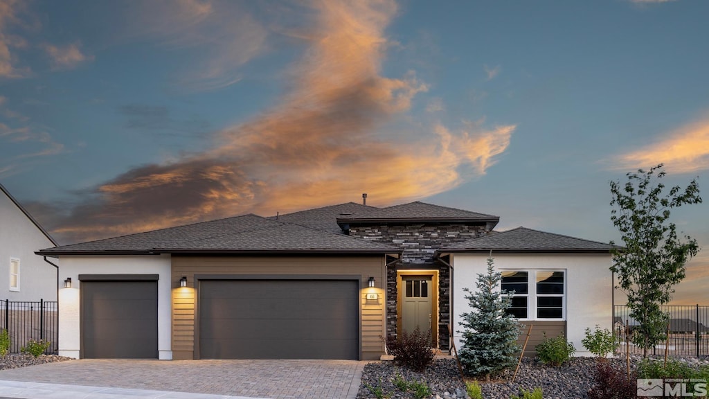 prairie-style house featuring a garage