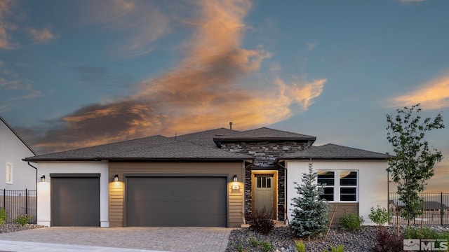 prairie-style house featuring a garage