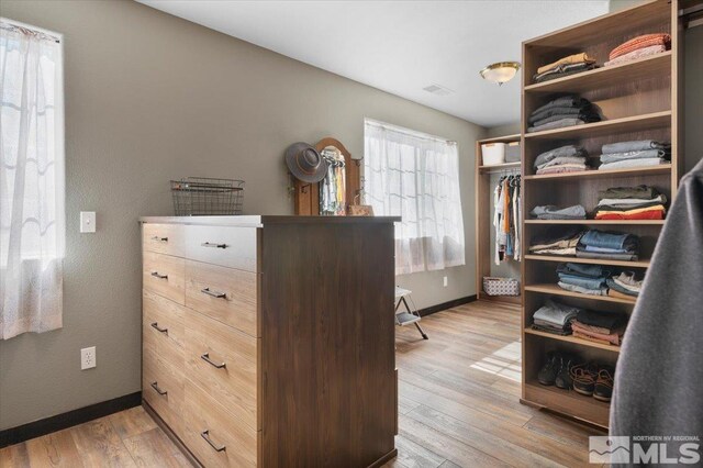 spacious closet with light wood-type flooring