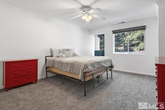 carpeted bedroom featuring ceiling fan and ornamental molding