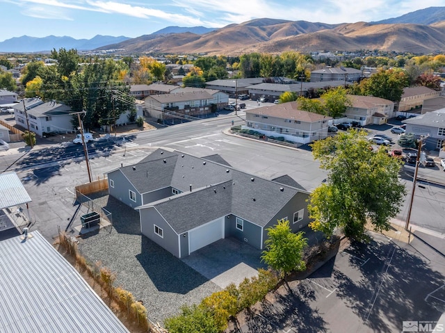 birds eye view of property with a mountain view