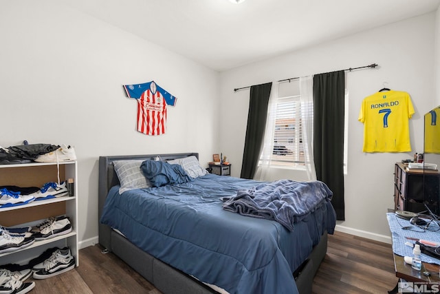 bedroom featuring dark wood-type flooring