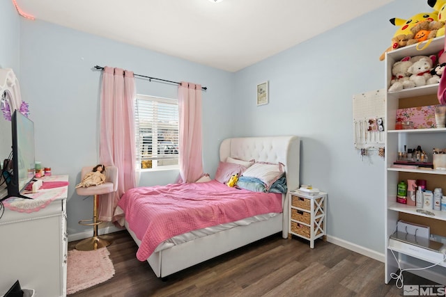 bedroom featuring dark hardwood / wood-style floors