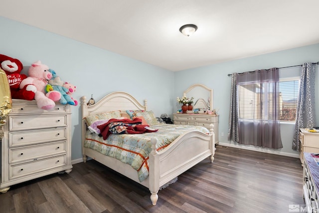 bedroom featuring dark wood-type flooring