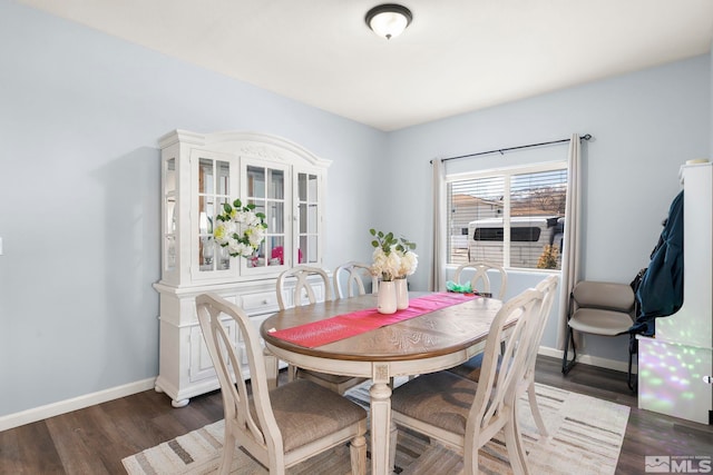 dining space featuring dark hardwood / wood-style flooring