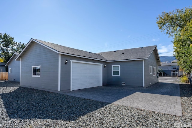 view of side of property with a garage