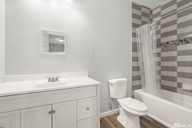 full bathroom featuring hardwood / wood-style floors, toilet, vanity, and shower / bath combo