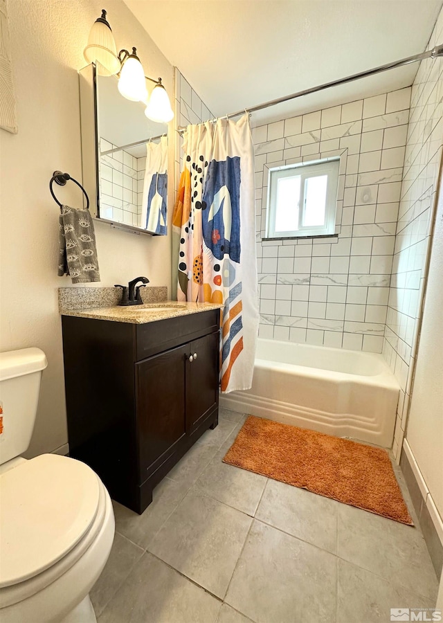 full bathroom with vanity, shower / bath combo with shower curtain, toilet, and tile patterned floors