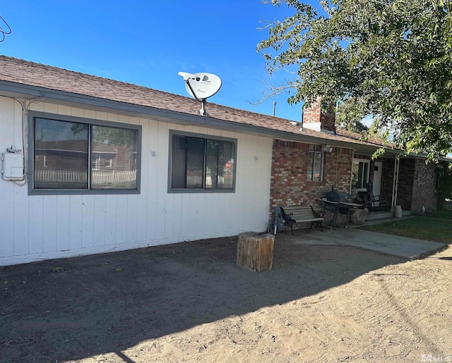 back of property featuring a patio