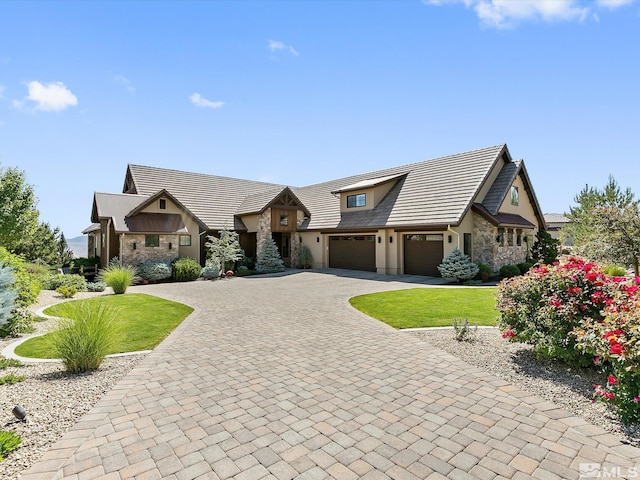 view of front of home featuring a front lawn and a garage