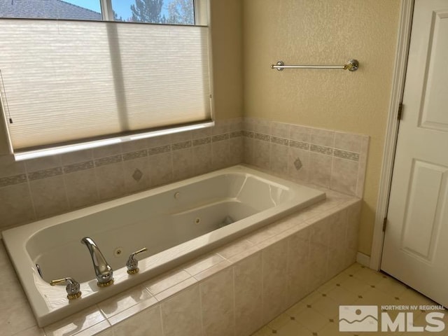 bathroom featuring tiled bath