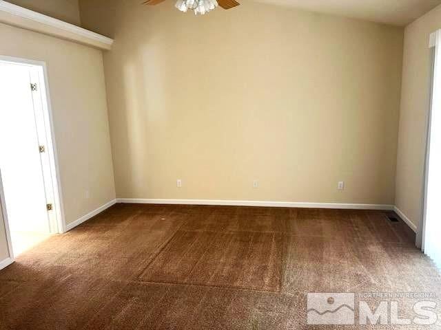 carpeted empty room with ceiling fan