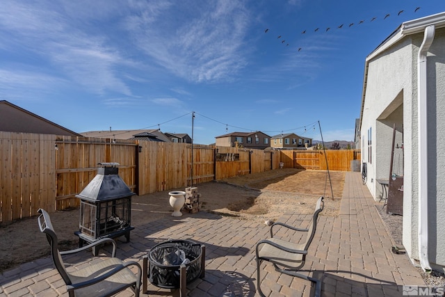 view of patio featuring an outdoor fire pit