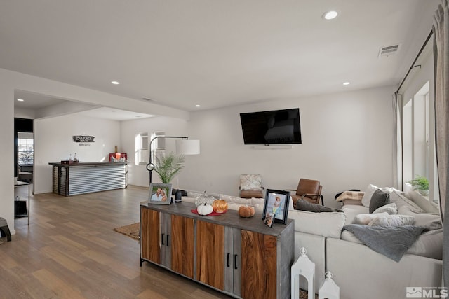 living room with dark hardwood / wood-style flooring