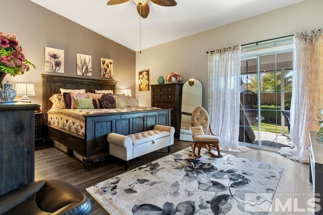 bedroom featuring access to outside, dark hardwood / wood-style floors, lofted ceiling, and ceiling fan