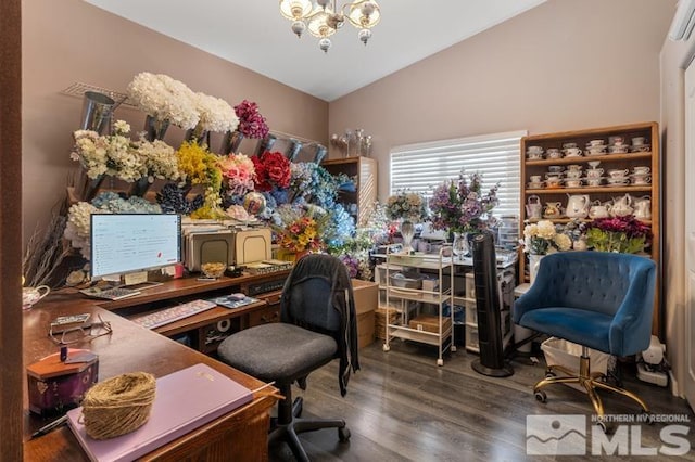 home office with a notable chandelier, wood-type flooring, and vaulted ceiling