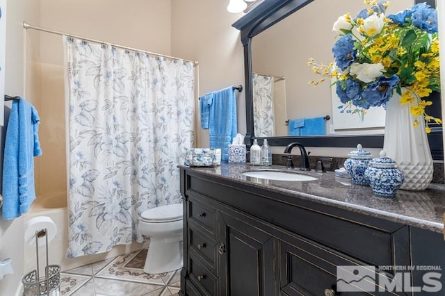 full bathroom with vanity, shower / tub combo with curtain, toilet, and tile patterned floors