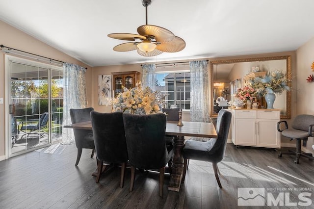 dining area with ceiling fan, lofted ceiling, and dark hardwood / wood-style flooring