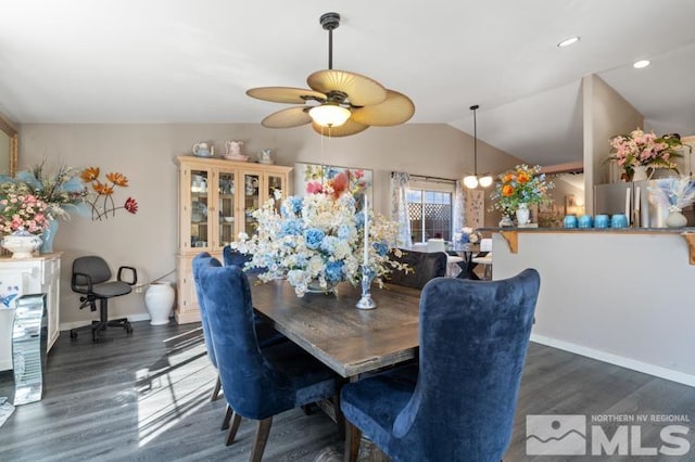 dining space featuring lofted ceiling, ceiling fan, and dark hardwood / wood-style flooring