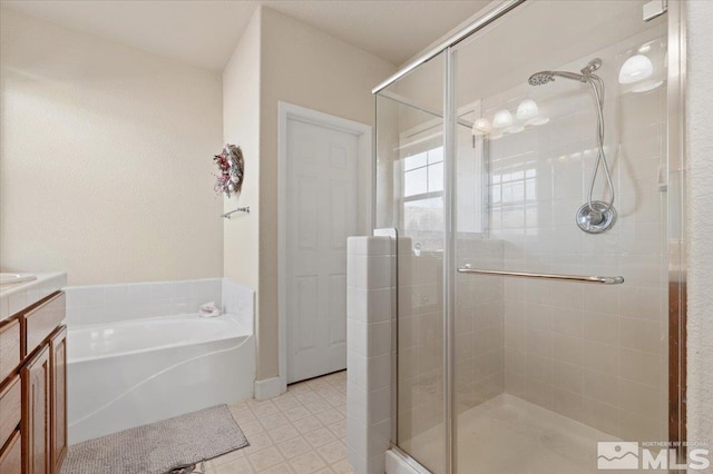 bathroom featuring vanity and plus walk in shower