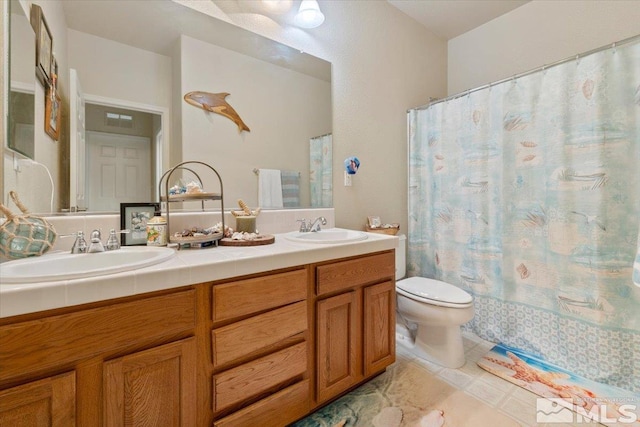 bathroom featuring vanity, a shower with curtain, and toilet