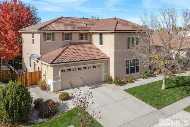 view of front facade with a front lawn and a garage