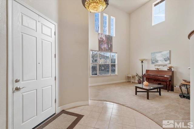 entryway featuring light carpet