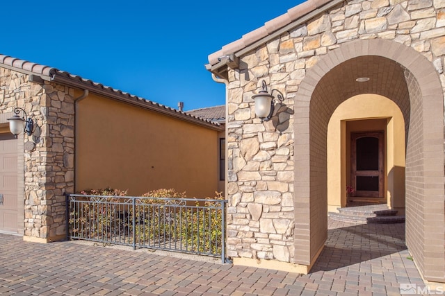 view of exterior entry featuring a garage