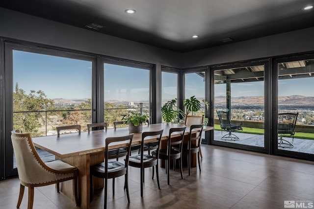 dining room featuring a mountain view