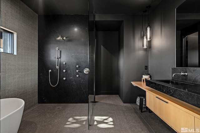 bathroom with tile walls, vanity, and plus walk in shower