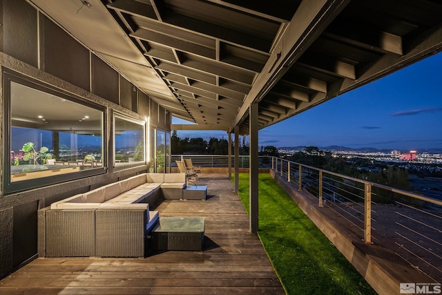 deck at dusk featuring an outdoor living space