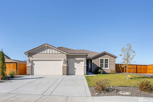 ranch-style home with a garage and a front lawn