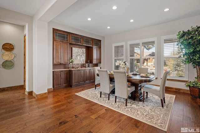 dining area with dark hardwood / wood-style floors