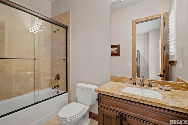 full bathroom with toilet, enclosed tub / shower combo, and vanity