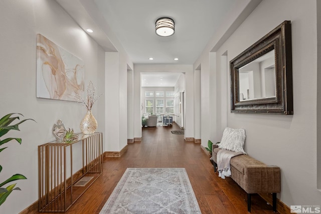 hall with dark wood-type flooring