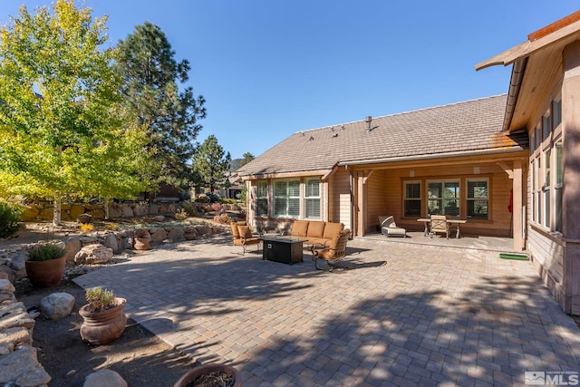 back of house with a patio area