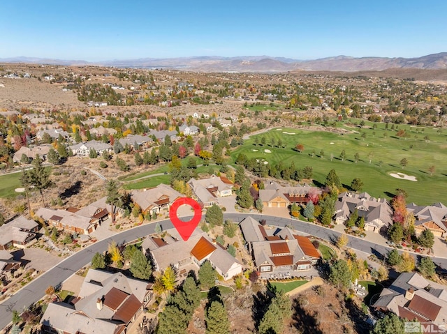 birds eye view of property with a mountain view