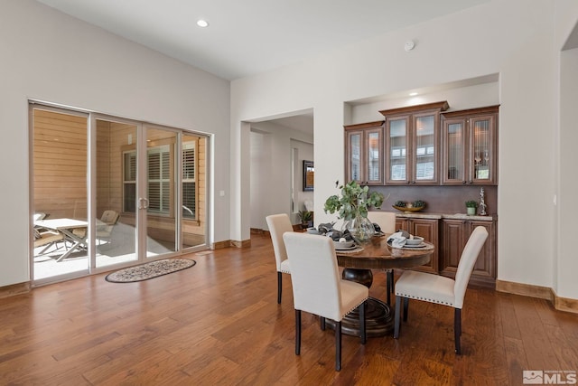 dining area with dark hardwood / wood-style floors