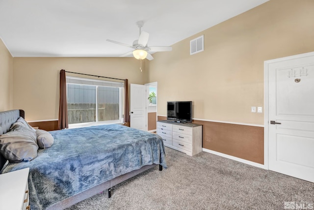 bedroom featuring carpet, vaulted ceiling, and ceiling fan