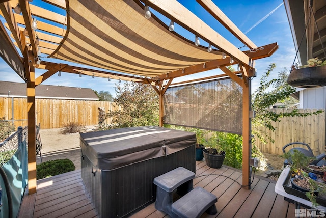 deck featuring a hot tub